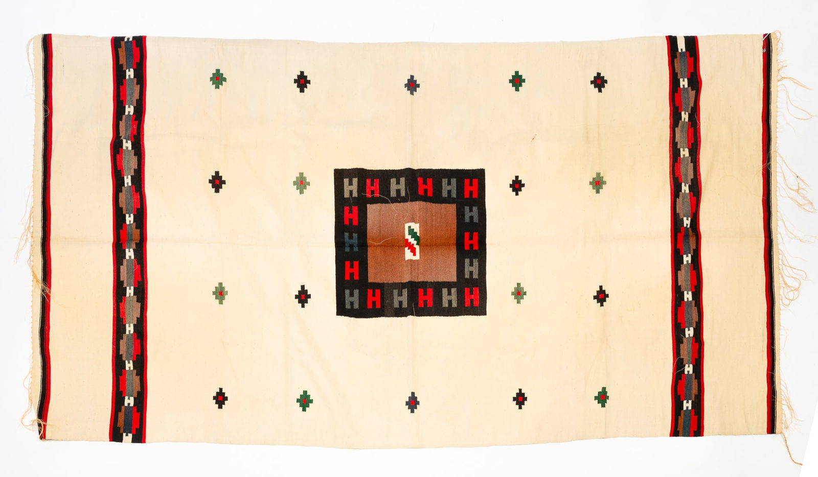 FINE MEXICAN WOOL BLANKET.: Mexico, First-half 20th Century. Having a polychrome geometric designs on a cream field, made of two pieces sewn together, with fringed ends, the verso having a rod pocket for hanging. Approx. 44"h. 7