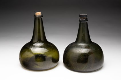 TWO EUROPEAN FREE BLOWN OLIVE GREEN GLASS ONION BOTTLES.