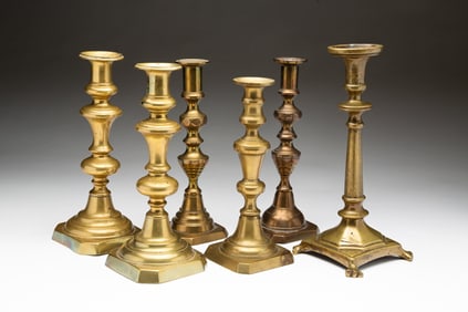 SIX BRASS CANDLESTICKS.