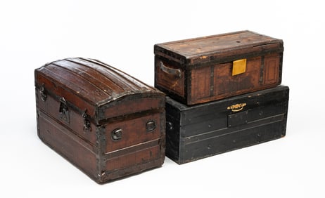 THREE AMERICAN TRAVEL TRUNKS.