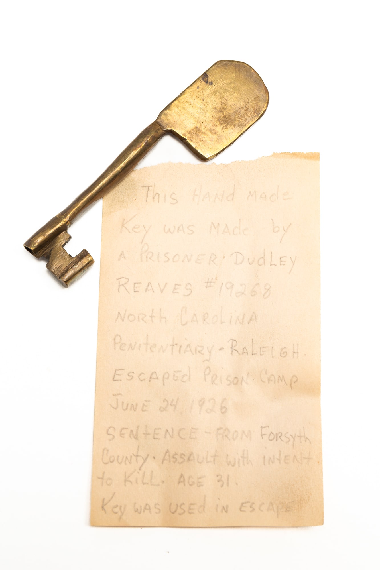 NORTH CAROLINA PENITENTIARY ESCAPED PRISONER'S FORGED KEY.: American, 20th Century. Prison number 19268. Dudley Reaves escaped June 24, 1926 using this handmade key. 4"l.Provenance: From the Lifetime Collection of the late Ken Hanna (Chester, New Jersey).