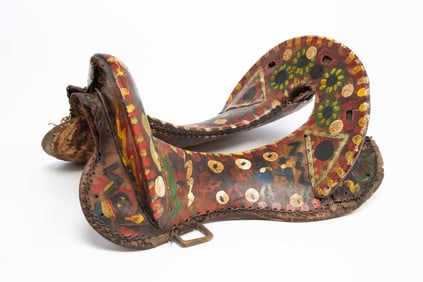 FOLKSY PAINT DECORATED RAWHIDE SADDLE.