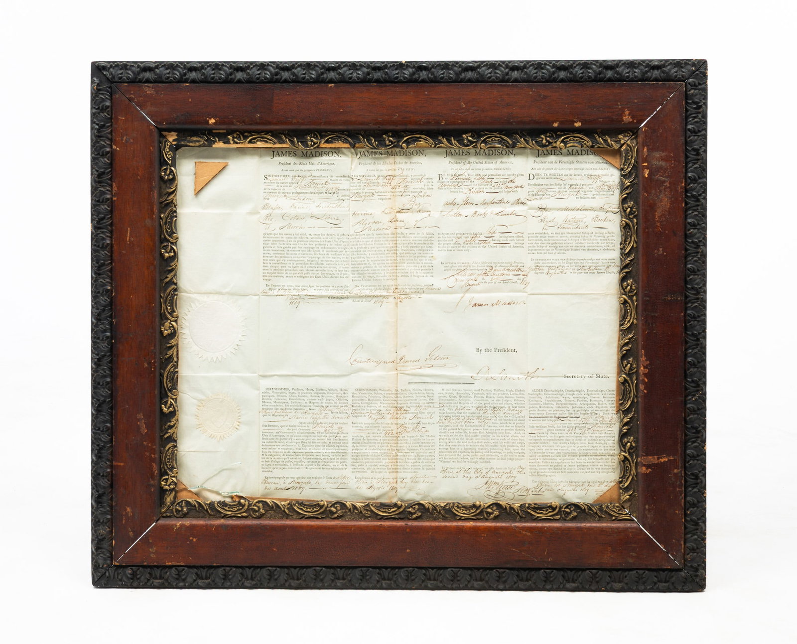 AMERICAN 1809 SHIP MASTERS PASSPORT SIGNED BY JAMES MADISON.: Printed in French, Spanish, English and German. Allows Samuel Tripp of ship AVERICK dated August 2, 1809. At left is embossed United States Seal and William Kease Notary of State of New York. Framed, 