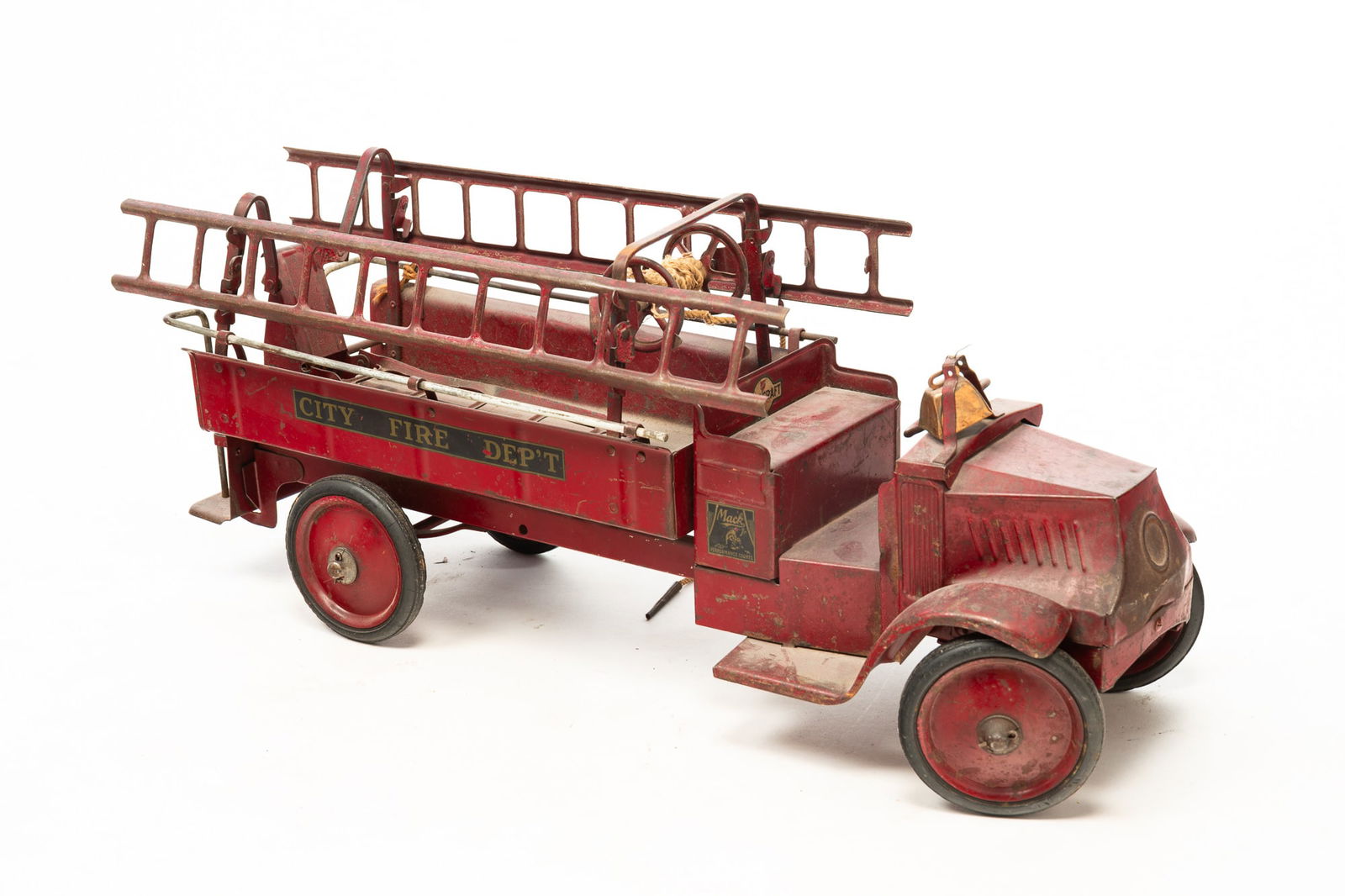 STEELCRAFT MACK JR. HOOK AND LADDER TOY TRUCK.: American, ca. 1930. Pressed and painted steel toy fire truck with extendable ladder. 11"h. 9"w. 26.5"l.Provenance: From the Lifetime Collection of the late Ken Hanna (Chester, New Jersey).
