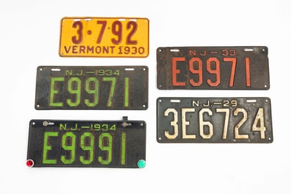 FIVE LICENSE PLATES.