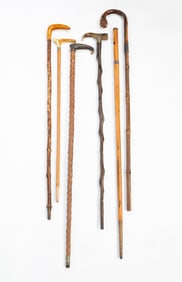 GROUP OF SIX FOLK ART CANES OR WALKING STICKS.