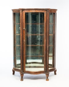 LATE VICTORIAN QUARTER SAWN OAK AND CURVED GLASS CHINA CABINET.