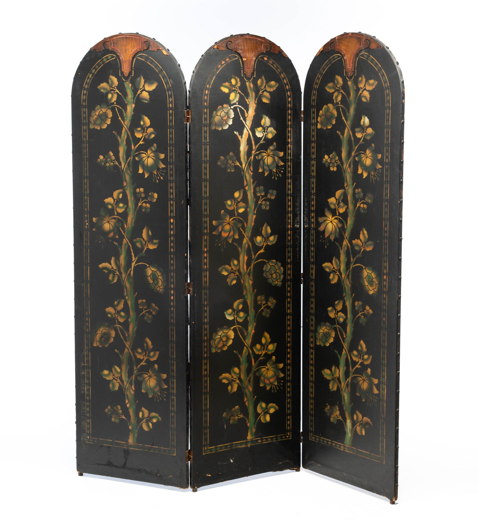 AMERICAN STENCILED LEATHER THREE-PANEL SCREEN.: American, 20th Century. Three hinged sections, each having a stenciled floral design and topped with a shaped wooden crest, raised on metal feet. Each panel, 67"h. 19"w.Provenance: From the Lifetime C