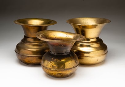 THREE BRASS SPITTOONS.