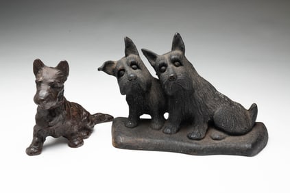 TWO AMERICAN SCOTTISH TERRIER IRON DOOR STOPS.