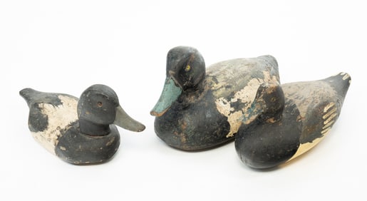 THREE AMERICAN CARVED AND PAINTED BLUEBILL DUCK DECOYS.