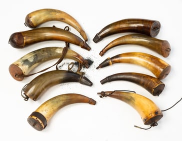 COLLECTION OF TEN POWDER HORNS, INCL. TWO ENGRAVED EXAMPLES.