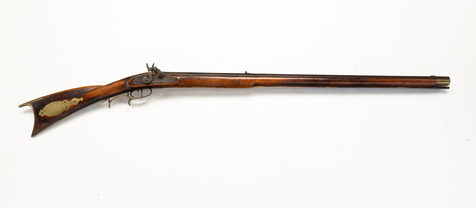 AMERICAN DOUBLE BARREL TIGER MAPLE FULL STOCK RIFLE.: America, Mid-19th Century. Tiger maple. Percussion locks, double triggers, Octagonal barrels, brass hardware and patchbox, silver crescent moon and heart inlay and forty caliber. 51.25"l.