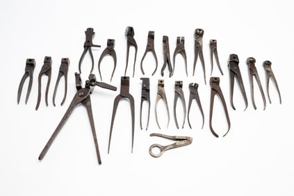 TWENTY-TWO IRON BULLET MOLDS.