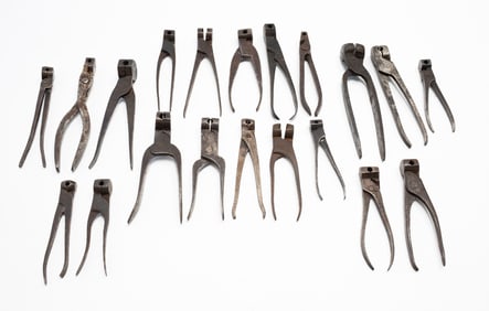 TWENTY IRON SCISSOR BULLET MOLDS.