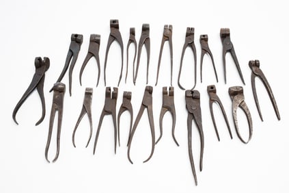 TWENTY IRON SCISSOR BULLET MOLDS.