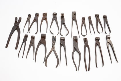 TWENTY IRON SCISSOR BULLET MOLDS.