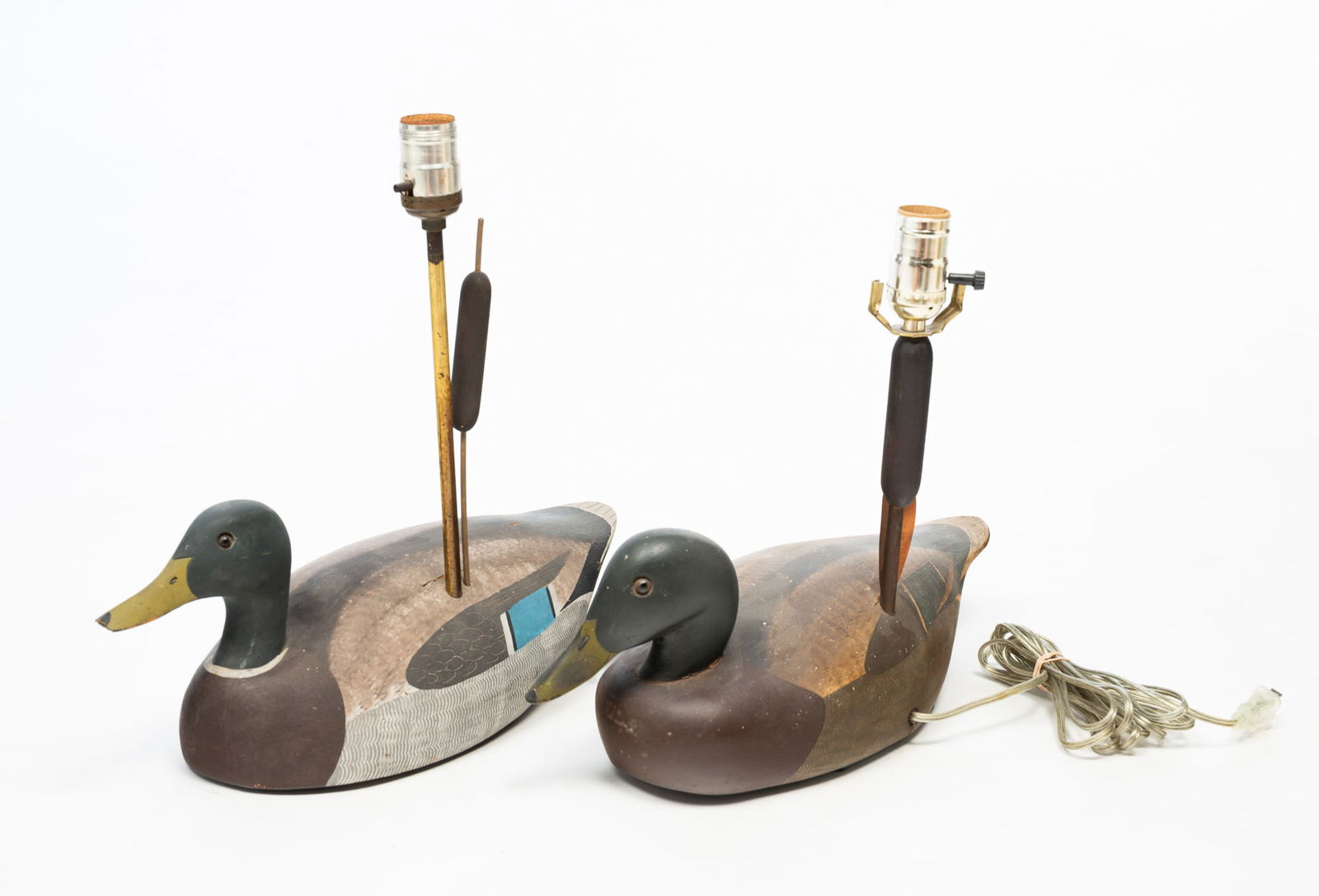 TWO AMERICAN KEN HARRIS DUCK DECOY LAMPS.: American (Woodville, New York), Late 20th Century. Well carved and painted mallards with gloss eyes. 6.5"h. 13" to top of socket. 16.5°l.