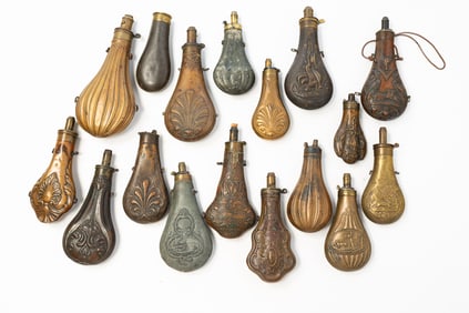 GROUP OF SEVENTEEN EMBOSSED BRASS, COPPER, AND METAL SHOT FLASKS.