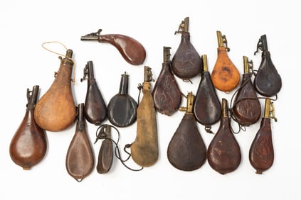 GROUP OF SEVENTEEN LEATHER SHOT FLASKS, INCL. JAMES DIXON & SONS.