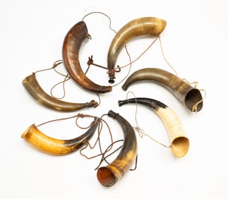 COLLECTION OF SEVEN LARGE POWDER HORNS.