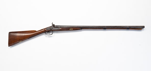 AMERICAN DOUBLE BARREL TWELVE GUAGE SHOT GUN.
