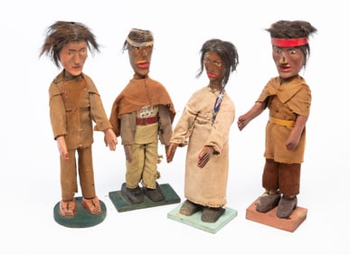 GROUP OF FOUR FOLK ART CARVED NATIVE AMERICAN DOLLS.