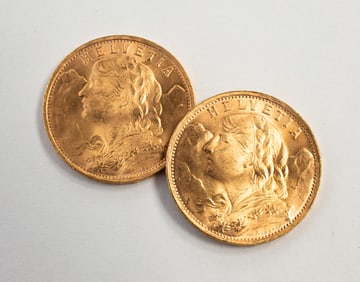 TWO SWISS GOLD 20 FRANCS HELVETIA COINS.