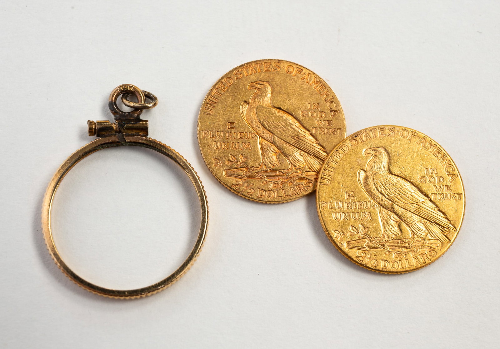 TWO AMERICAN $2.50 INDIAN HEAD GOLD COINS.: America, Early 20th Century. Two gold $2.50 Indian Head coins. 1908 and 1925. 18mm. Approximately 8.3 g.