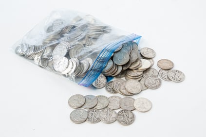 SEVEN POUNDS OF UNSEARCHED HALF DOLLARS, MOSTLY SILVER.