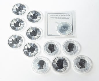 TWELVE ONE OUNCE FINE SILVER COINS.