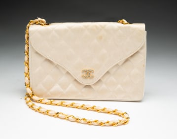 CHANEL QUILTED BEIGE SATIN MINI CLUTCH WITH CHAIN.