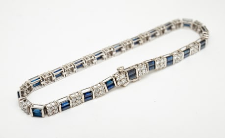 14K WHITE GOLD DIAMOND AND SAPPHIRE TENNIS BRACELET.