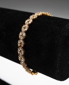 18K YELLOW GOLD FANCY LINK DIAMOND TENNIS BRACELET.