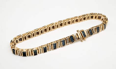14K YELLOW GOLD DIAMOND AND SAPPHIRE TENNIS BRACELET.