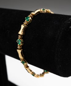 14K GOLD EMERALD AND DIAMOND BRACELET.