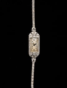 LADIES PLATINUM AND DIAMOND WRISTWATCH.