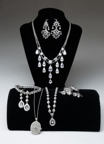 GROUP OF STERLING SILVER AND RHINESTONE JEWELRY.