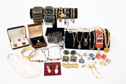 LARGE ASSORTMENT OF COSTUME JEWELRY.