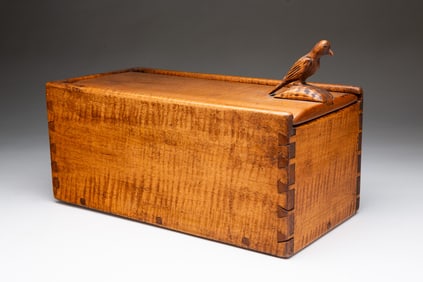 UNUSUAL TIGER MAPLE DOVETAILED AND PEGGED CANDLE BOX WITH SONGBIRD FINIAL.
