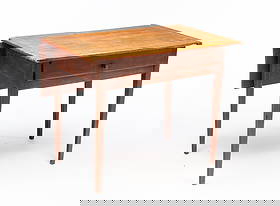 AMERICAN HEPPLEWHITE RED-WASHED DROP-LEAF WORK TABLE.: 19th Century. Pine, maple, and poplar. Having a rectangular top with breadboard ends and a single, rear drop leaf as well as a dovetailed frieze drawer. It rises on square tapered legs. 28.5"h. 35.75"