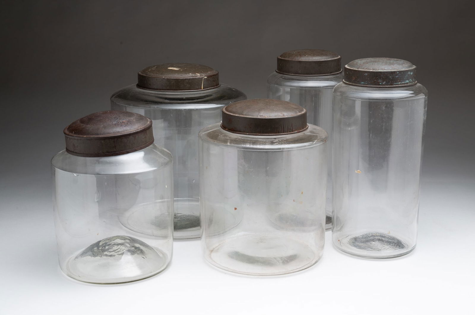 FIVE AMERICAN GLASS AND TIN-LIDDED CANISTERS. (1 of 5)