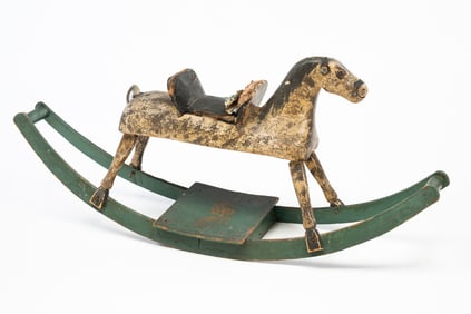 AMERICAN CARVED AND PAINT-DECORATED CHILD'S ROCKING HORSE.
