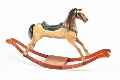 AMERICAN CARVED AND PAINT-DECORATED CHILD'S ROCKING HORSE.