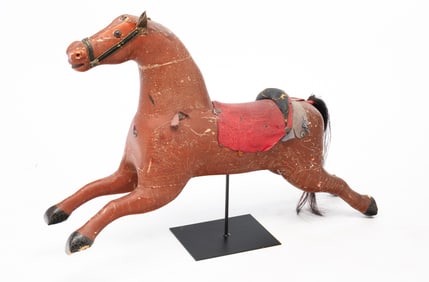 AMERICAN CARVED AND PAINT-DECORATED CHILD'S ROCKING HORSE ON LATER STAND.