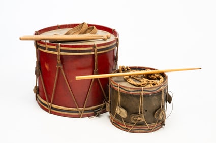 TWO RED, WHITE, AND BLUE-PAINTED MILITARY SNARE DRUMS.