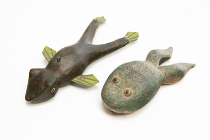 TWO AMERICAN FOLK ART CARVED AND PAINTED FROG ICE FISHING DECOYS.