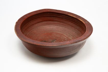 AMERICAN BRICK RED-PAINTED, TURNED, AND CARVED WOOD BOWL.