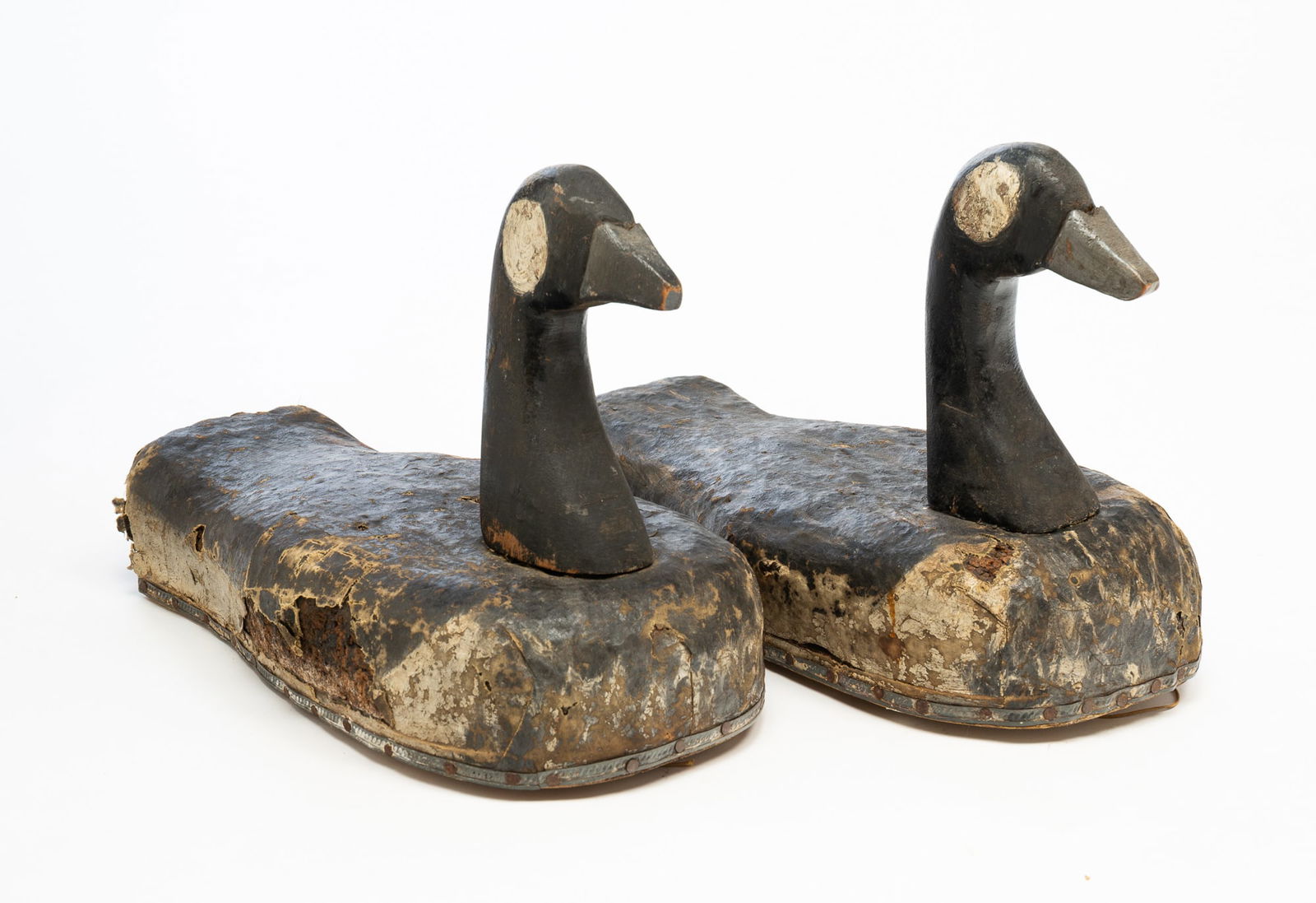 PAIR OF AMERICAN FOLKSY CARVED PINE AND OIL CLOTH-LINED CORK CANADIAN GEESE DECOYS. (1 of 4)