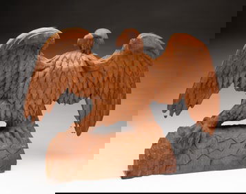 AMERICAN FOLK ART CARVED WALNUT SPREAD-WINGED EAGLE.